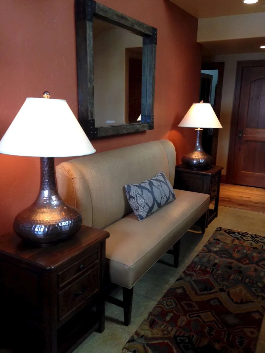 Armchair beside a small accent table near a window